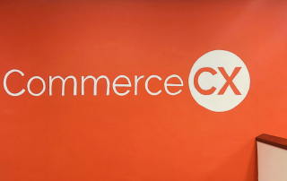 The CommerceCX mural, painted on the back wall of the Cary office image.